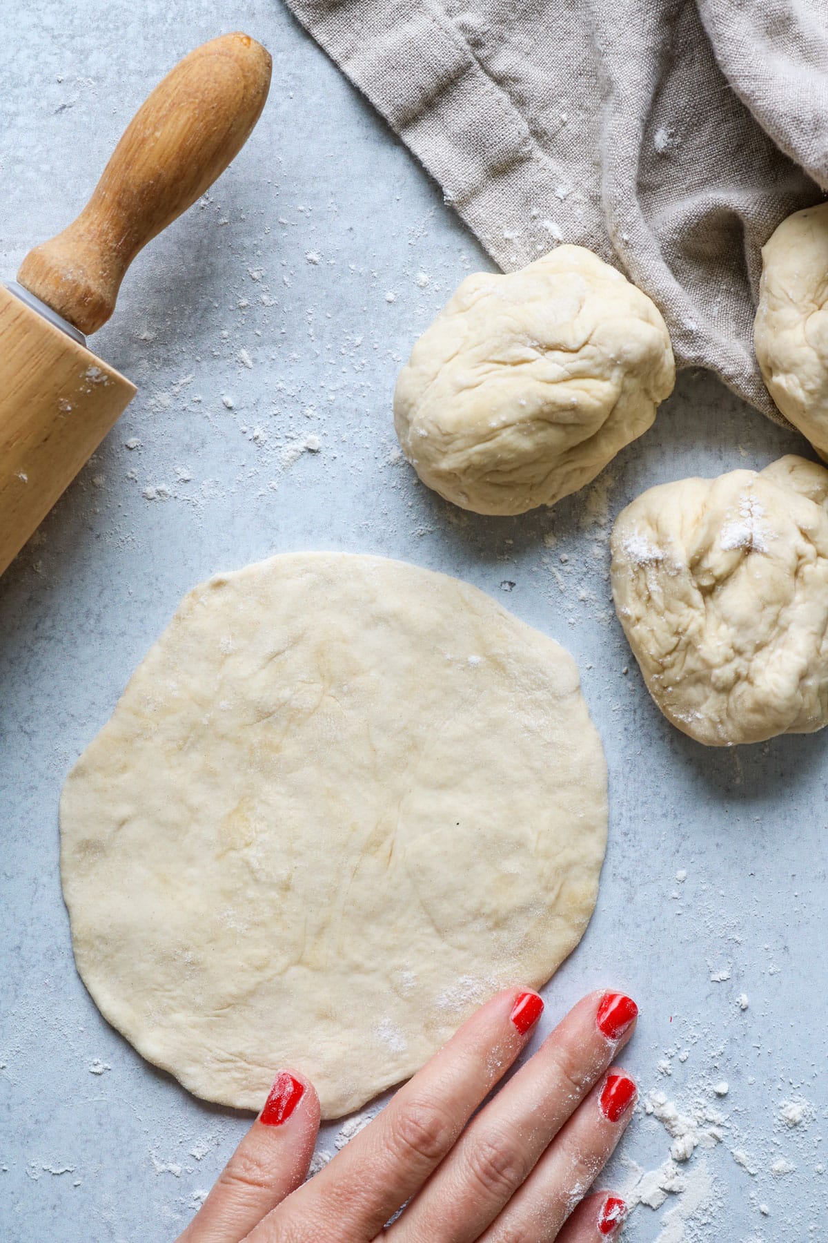 Flatbread dough rolled out into circles.