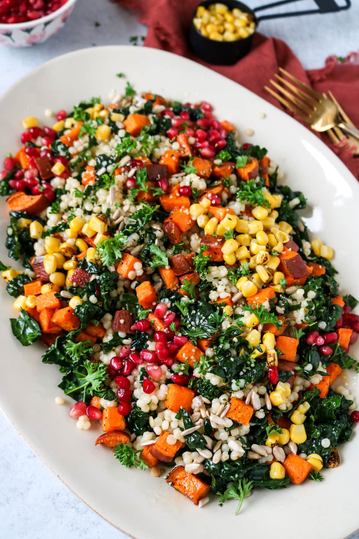 couscous salad with kale, sweet potato and pomegranate