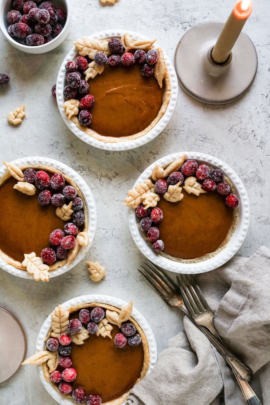 mini vegan pumpkin pies on a thanksgiving table. 