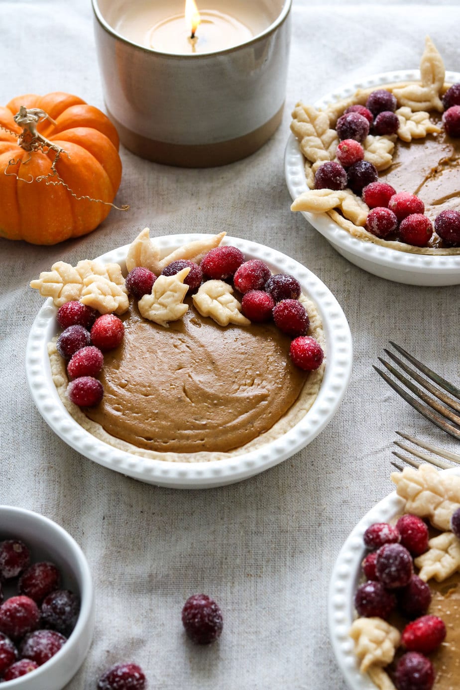 mini vegan pumpkin pies on a thanksgiving table. 